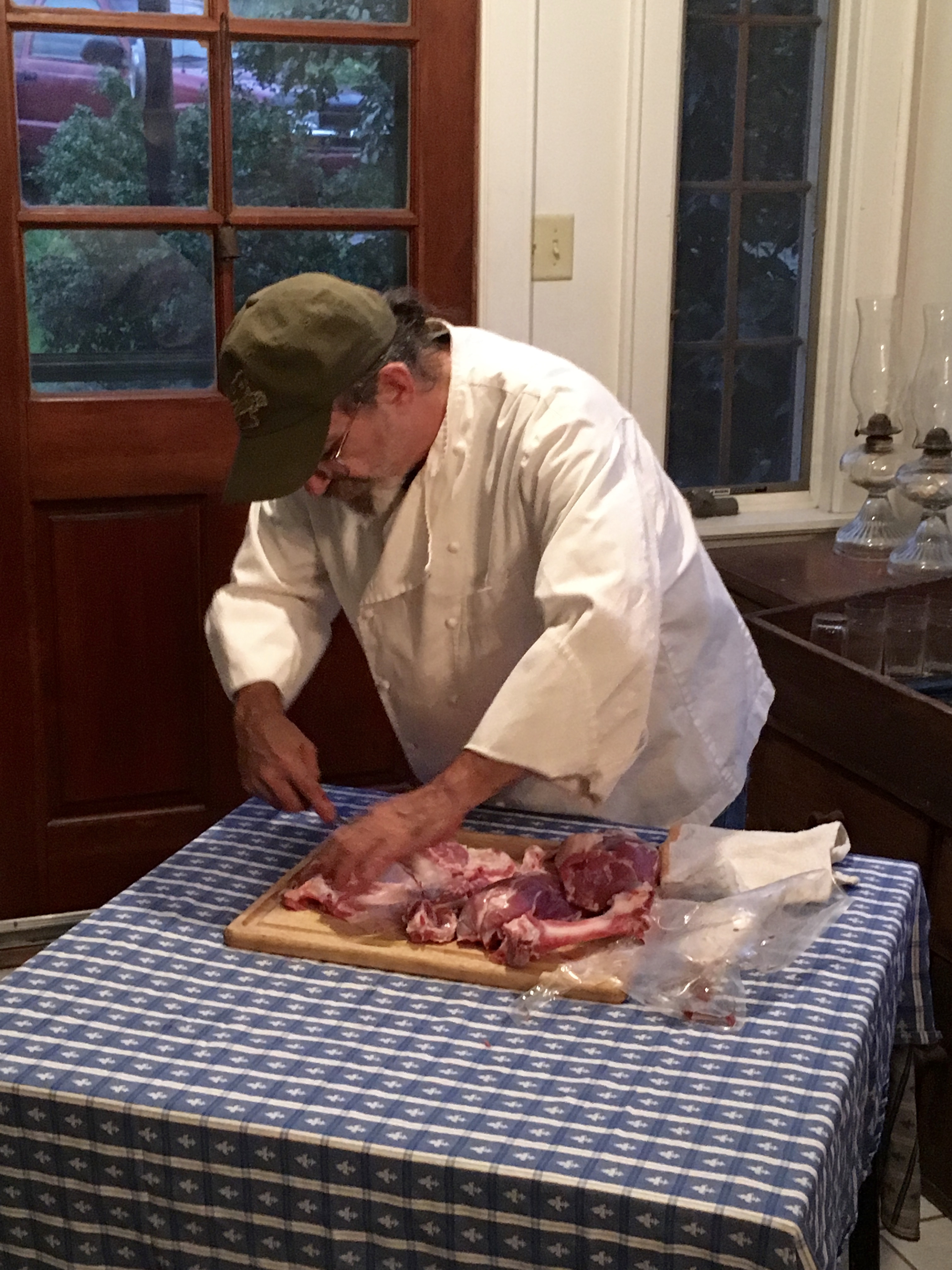 Demonstration of carving cuts from an upper leg of lamb
